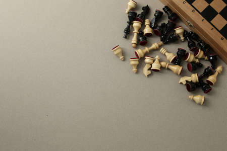 Chess wooden pieces and board on a light backgroundの写真素材