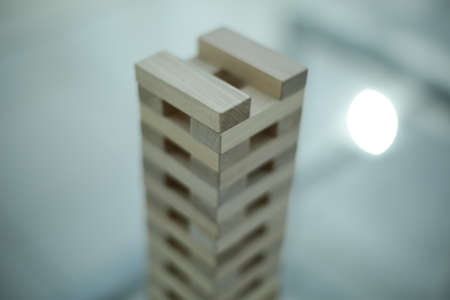 Board game - wooden bars on a glass table in officeの写真素材