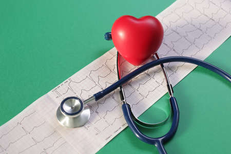Cardiogram Stethoscope Heart on green background