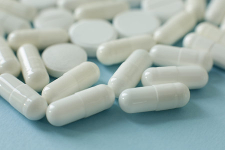 White pills on blue background