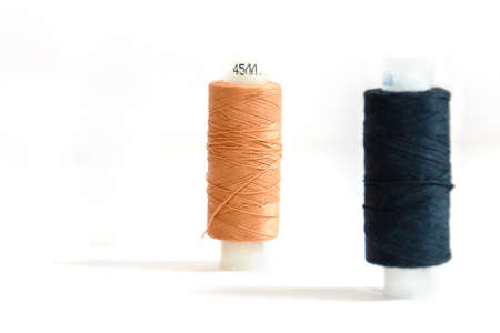 beige skein and black in soft focus isolated on white backgroundの写真素材