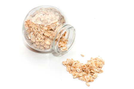 Oatmeal in a jar of glass on a white background, healthy eating and diet concept. Top view.の写真素材