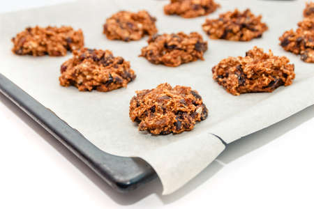 Homemade oatmeal cookies and oat flakes. Proper nutrition conceptの写真素材