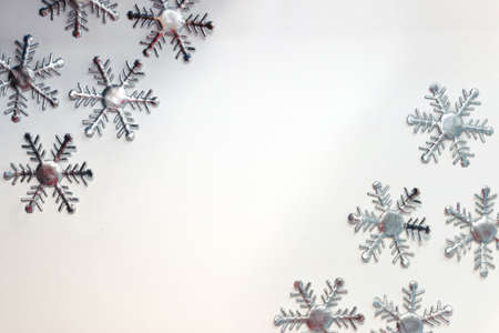 ChristmaChristmas composition. Christmas frame made of snowflakes on grey background. Winter concept. Flat lay, top view, copy space.の写真素材