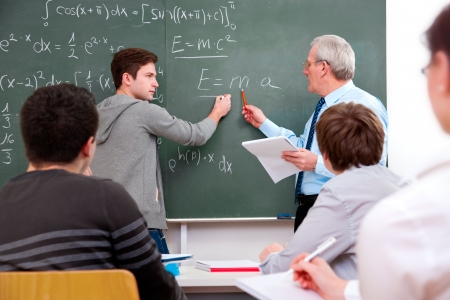 teacher with a group of high school students in classroom teacher with a group of high school students in classroom