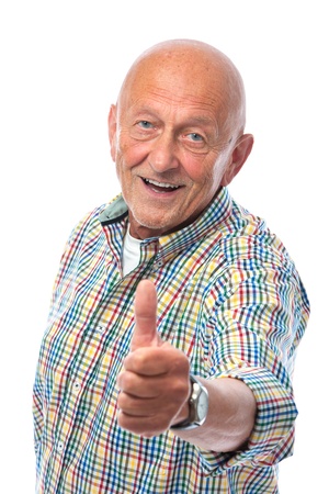 happy senior man shows thumbs up isolated on whiteの写真素材