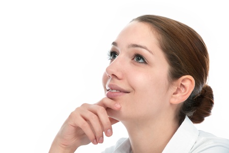 Beautiful thoughtful woman looking up - isolated over whiteの写真素材