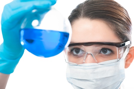 female scientific researcher looking at a liquid solution