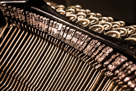 Close-up of old worn types of antique typewriter