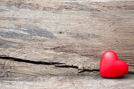 Red heart in crack of wooden plank. Symbol of love, Valentine's Dayの写真素材