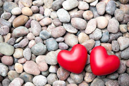 Two red hearts on pebble stones, still life. Valentines Day backgroundの写真素材