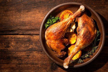 Roasted goose legs with oranges and spices. Cooking at Christmas timeの写真素材