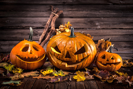 Halloween pumpkin head jack lantern with burning candlesの写真素材