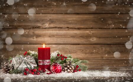Advent decoration with one burning candle on wooden board. Christmas backgroundの写真素材
