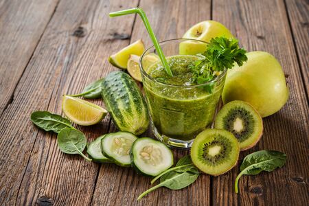 Green smoothie with apples, parsley, spinach, cucumber and limeの写真素材