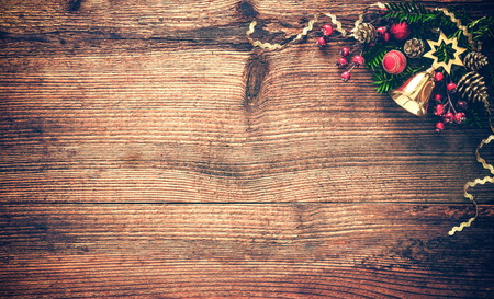 Christmas background with fir tree and decoration on dark wooden boardの写真素材