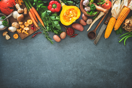 Traditional autumn vegetables ingredients for tasty Thanksgiving or Christmas dishes on rustic kitchen table. Top viewの写真素材