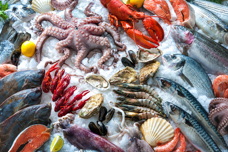 Seafood on ice at the fish marketの写真素材