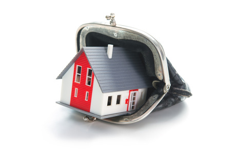Savings concept. House in leather wallet isolated on white background

の写真素材