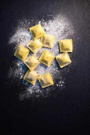 Ravioli on dark background, top viewのeditorial素材