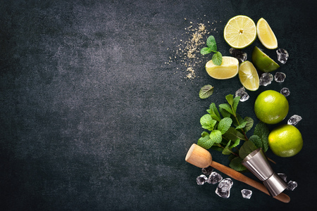 Mojito cocktail making. Mint, lime, ice ingredients and bar utensilsの写真素材