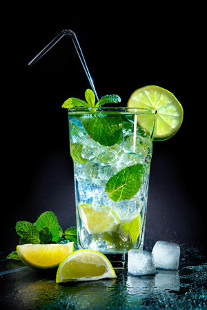 Mojito cocktail with fresh lime and mint on dark backgroundの写真素材