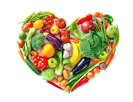 Heart shape by various vegetables and fruits. Healthy food concept. Isolated on white backgroundの写真素材