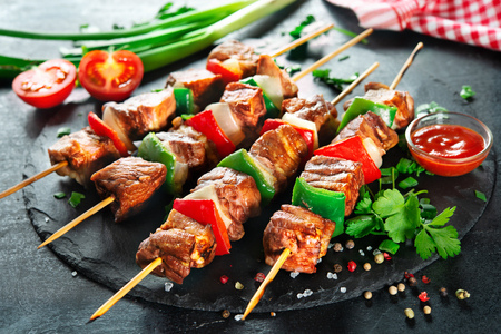 Kebabs - grilled meat and vegetables on skewersの写真素材