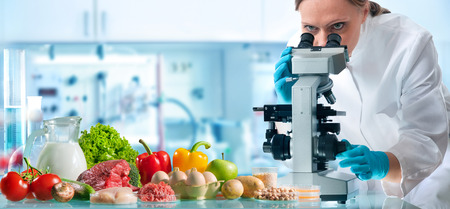 Food quality control expert inspecting specimens of groceries in the laboratoryの写真素材