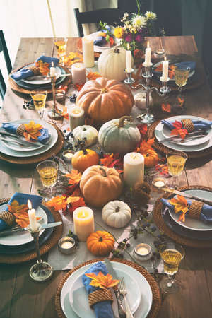 Thanksgiving celebration traditional dinner setting food concept. Festive decoraded table with...