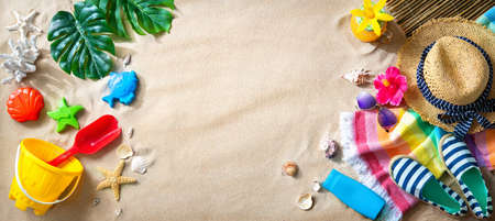 Ocean sand beach with sunbathing accessories. Summer travel and beach holiday background.  Concept...