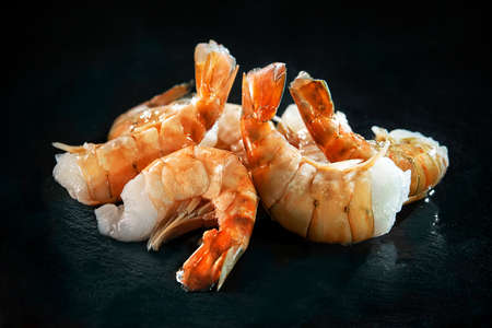 Fresh delicious prawns on dark backgroundの写真素材