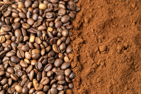 Top view of roasted coffee beans for background and texture. A pile of roasted and ground coffee beans can be used as a background and texture.の写真素材
