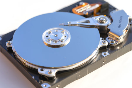 Disassembled hard drive from the computer, hdd with mirror effect. Opened hard drive from the...