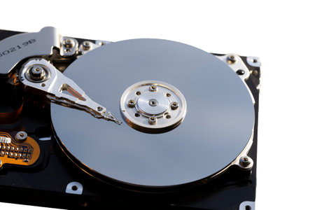 Disassembled hard drive from the computer, hdd with mirror effect. Opened hard drive from the computer hdd with mirror effects. Part of computer pc, laptopの写真素材