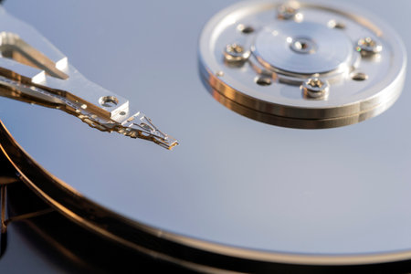 Disassembled hard drive from the computer, hdd with mirror effect. Opened hard drive from the computer hdd with mirror effects. Part of computer pc, laptopの写真素材