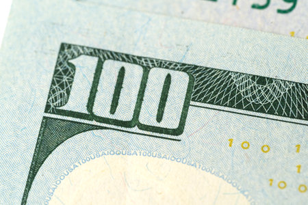 Close-up elements of dollar bills. Money, US dollar bills background. Paper money is scattered on the table. Photo for finance and economy concepts.の写真素材