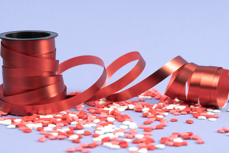 Valentine's hearts with red bows and red curly ribbon. Valentine's Dayの写真素材