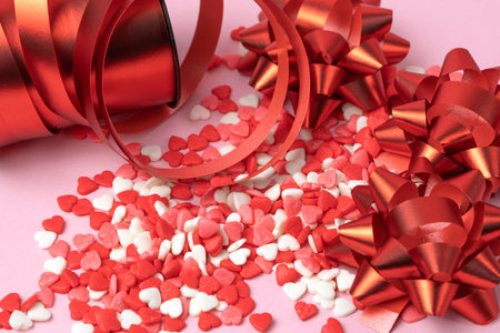 Valentine's hearts with red bows and red curly ribbon. Valentine's Dayの写真素材
