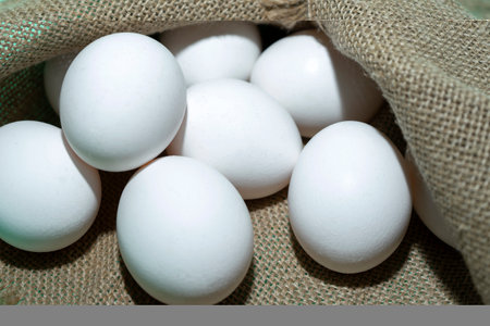 Close-up of Lots of raw whole brown and white chicken eggs for making fresh homemade food.