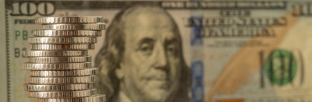 Money, US dollar bills background. Paper money is scattered on the table with silver coins. Photo...