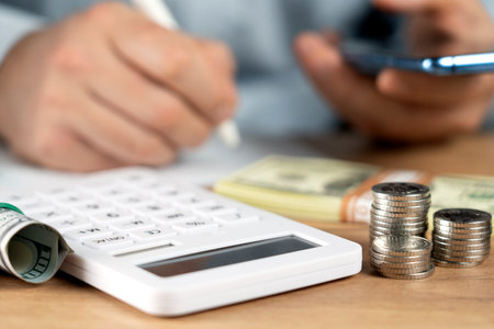 Business accounting concept, Business man using calculator with computer laptop, budget and loan...