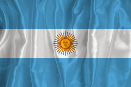 The flag of Argentina on a silk background is a great national symbol. Fabric texture The official state symbol of the country. Argentina flag backgroundの写真素材