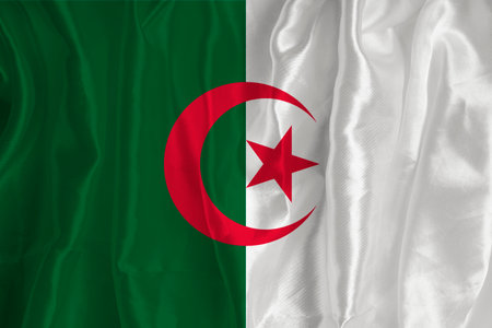 The flag of Algeria on a silk background is a great national symbol. Fabric texture The official state symbol of the country..の写真素材