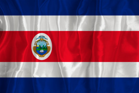 The flag of Costa Rica on a silk background is a great national symbol. Fabric texture The official...