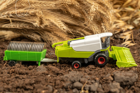 Tractor with money on the background of spikelets of wheat. Export of grain and agriculture. Rising prices for agricultural productsの写真素材