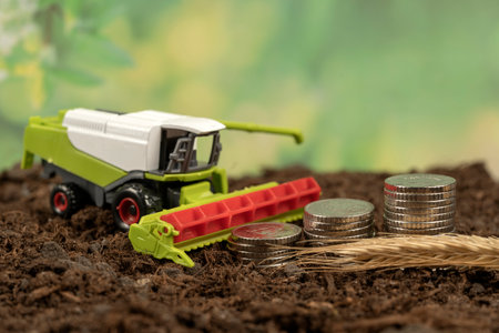 Combine harvester in the garden. The concept of harvesting and making money on agricultureの写真素材