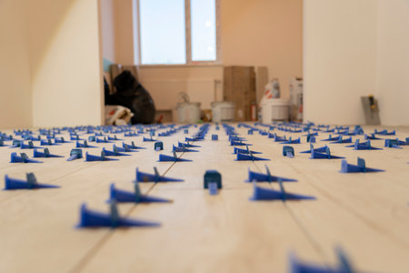 Repair and construction. Laying ceramic tiles using cement on the floor close-up.の写真素材