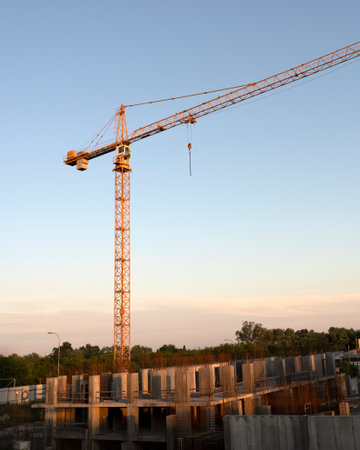 tower cranes at construction site and city backgroundの写真素材