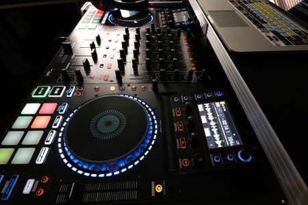DJ controller with mixer and laptop computer ready for partyの写真素材